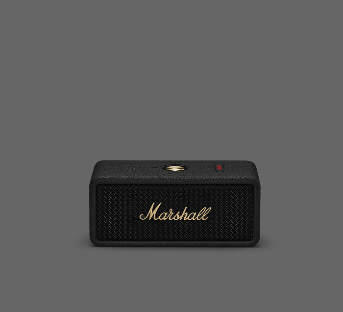 Marshall Emberton III Bluetooth-Lautsprecher im ikonischen Marshall-Design mit goldenen Details auf dunklem Hintergrund.